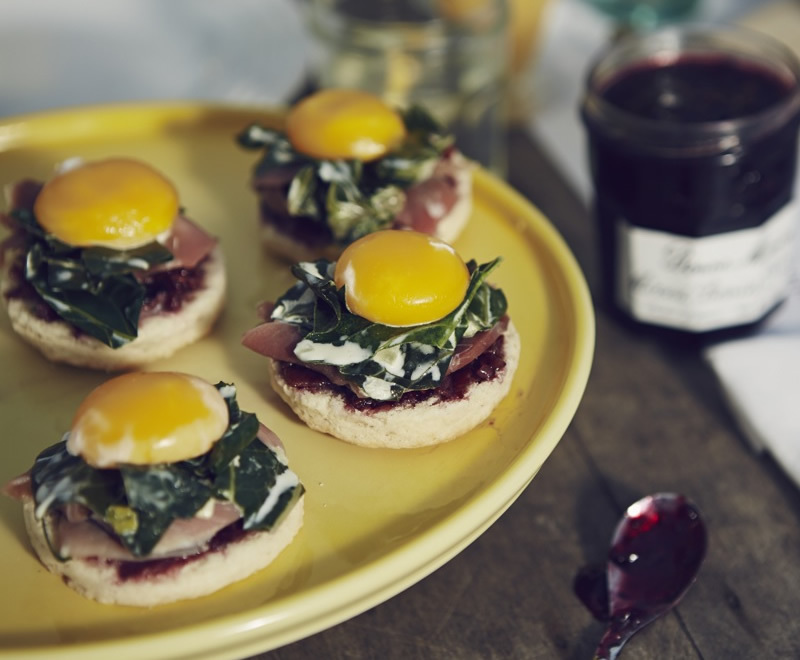 Ham Biscuits Benedict with Bacon-Berry Preserves and Creamy Braised Greens